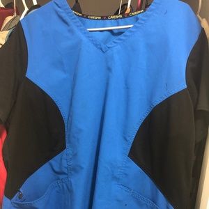 Care is a Women’s XL scrub top